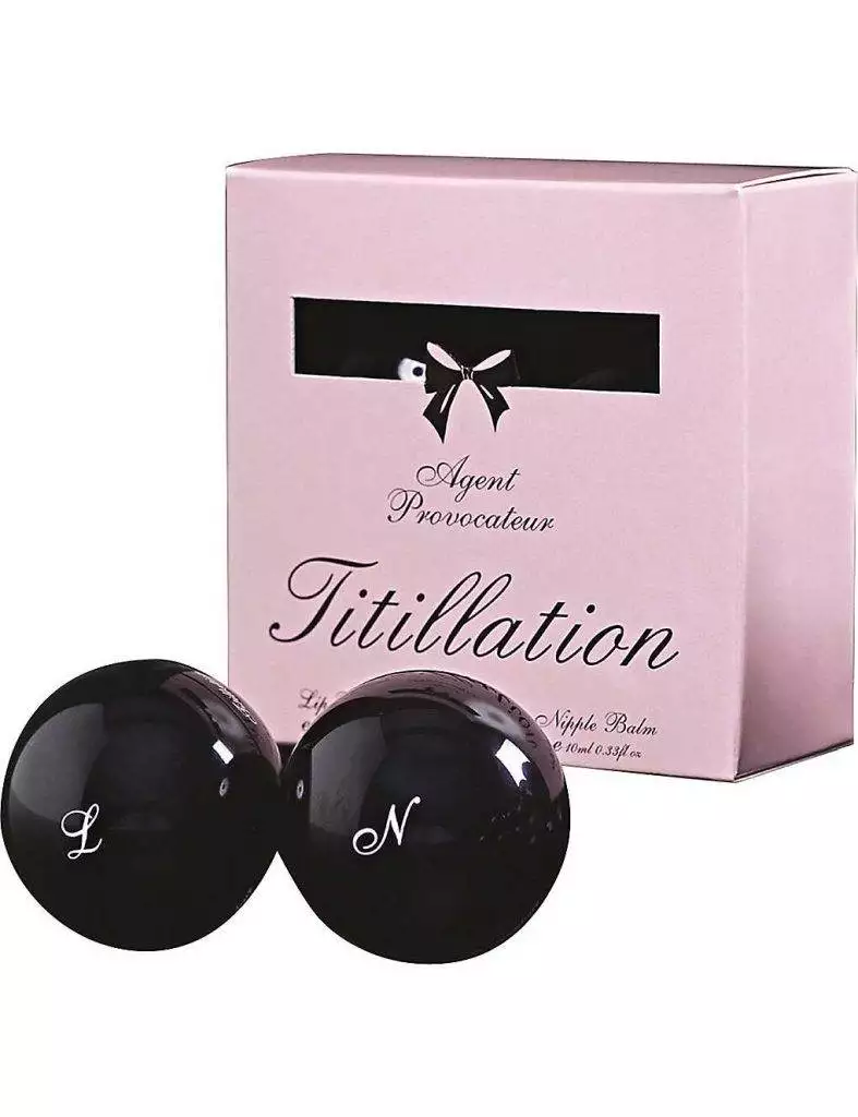 A pair of black and white bath bombs in a box.