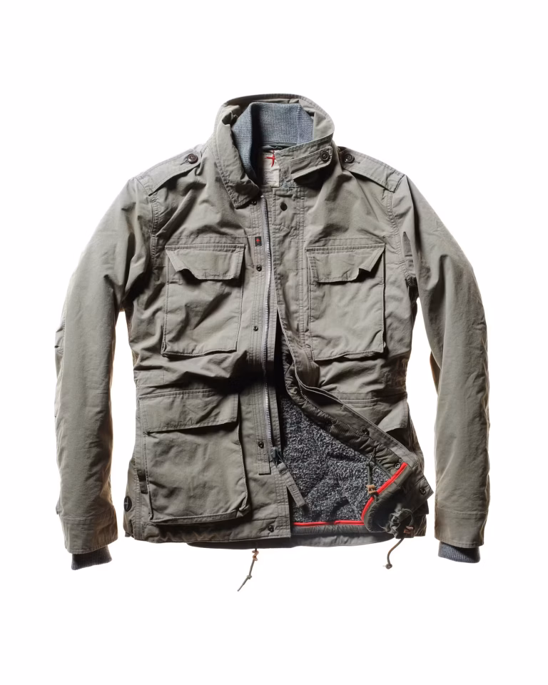 Olive green utility jacket with multiple pockets, partially unzipped to show inner lining and details—crafted in the signature Relwen Combat style, this versatile 2-in-1 jacket offers both function and effortless edge.