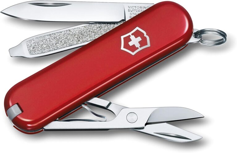 Red Victorinox Classic SD Swiss Army knife with open blade, nail file, and scissors—a small tool with a big legacy—plus a keyring attachment.